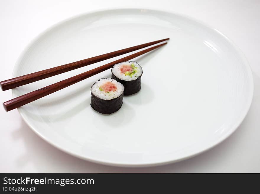 Sushi is a Japanese food consisting of cooked vinegared rice (shari) combined with other ingredients (neta), usually raw fish or other seafood. Sushi is a Japanese food consisting of cooked vinegared rice (shari) combined with other ingredients (neta), usually raw fish or other seafood.