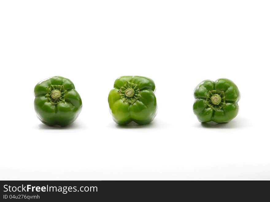 Three Green ball pepper on white background