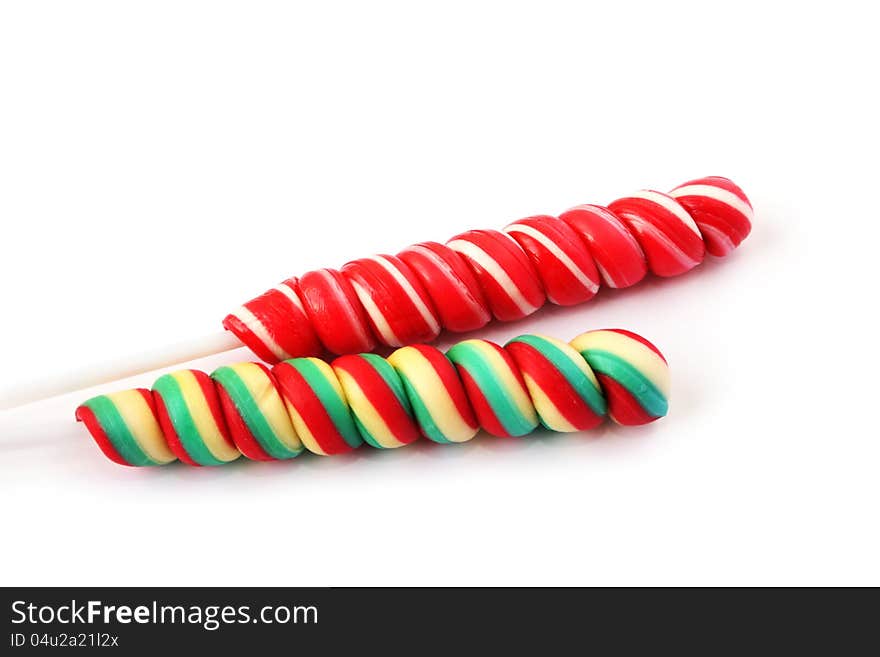 Colorful lollipops on white background.