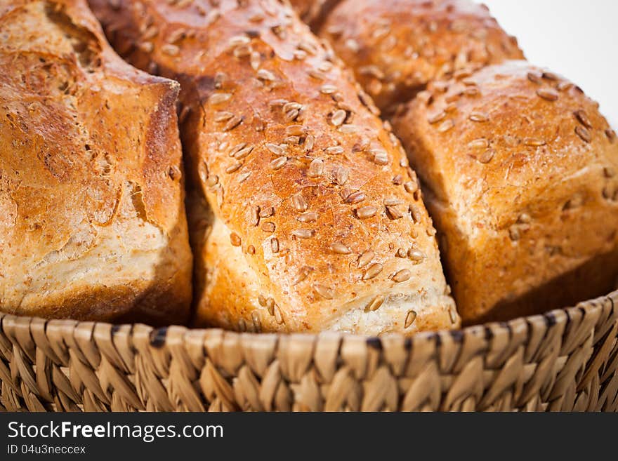 Loaf of bread with sunflower seeds in a basket. Shallow DOF. Loaf of bread with sunflower seeds in a basket. Shallow DOF