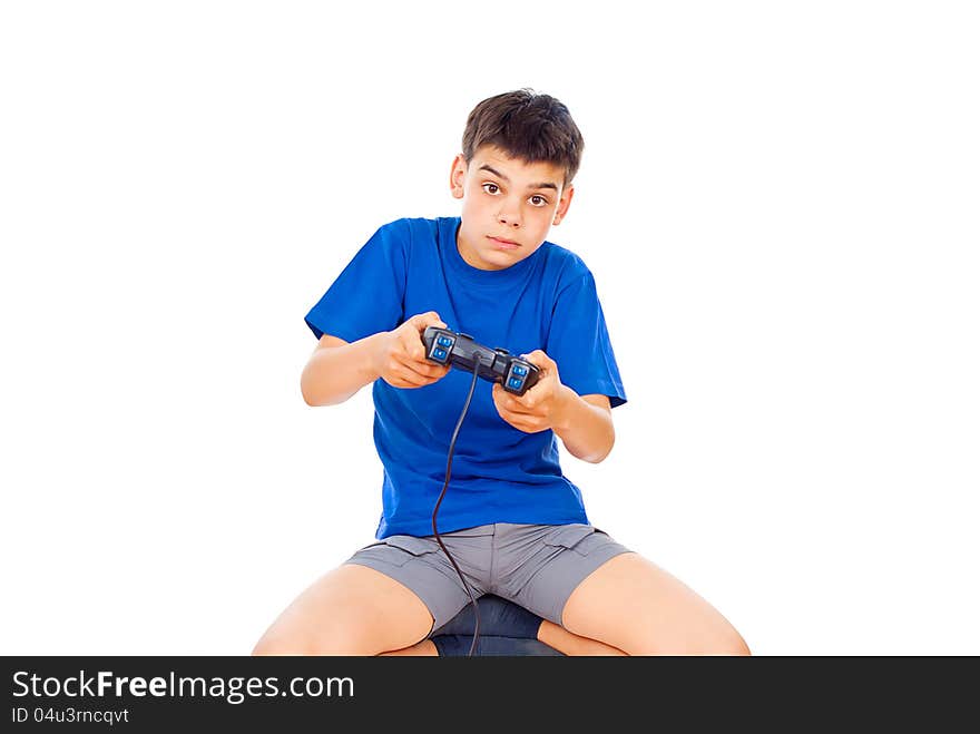 Boy playing computer games on the joystick