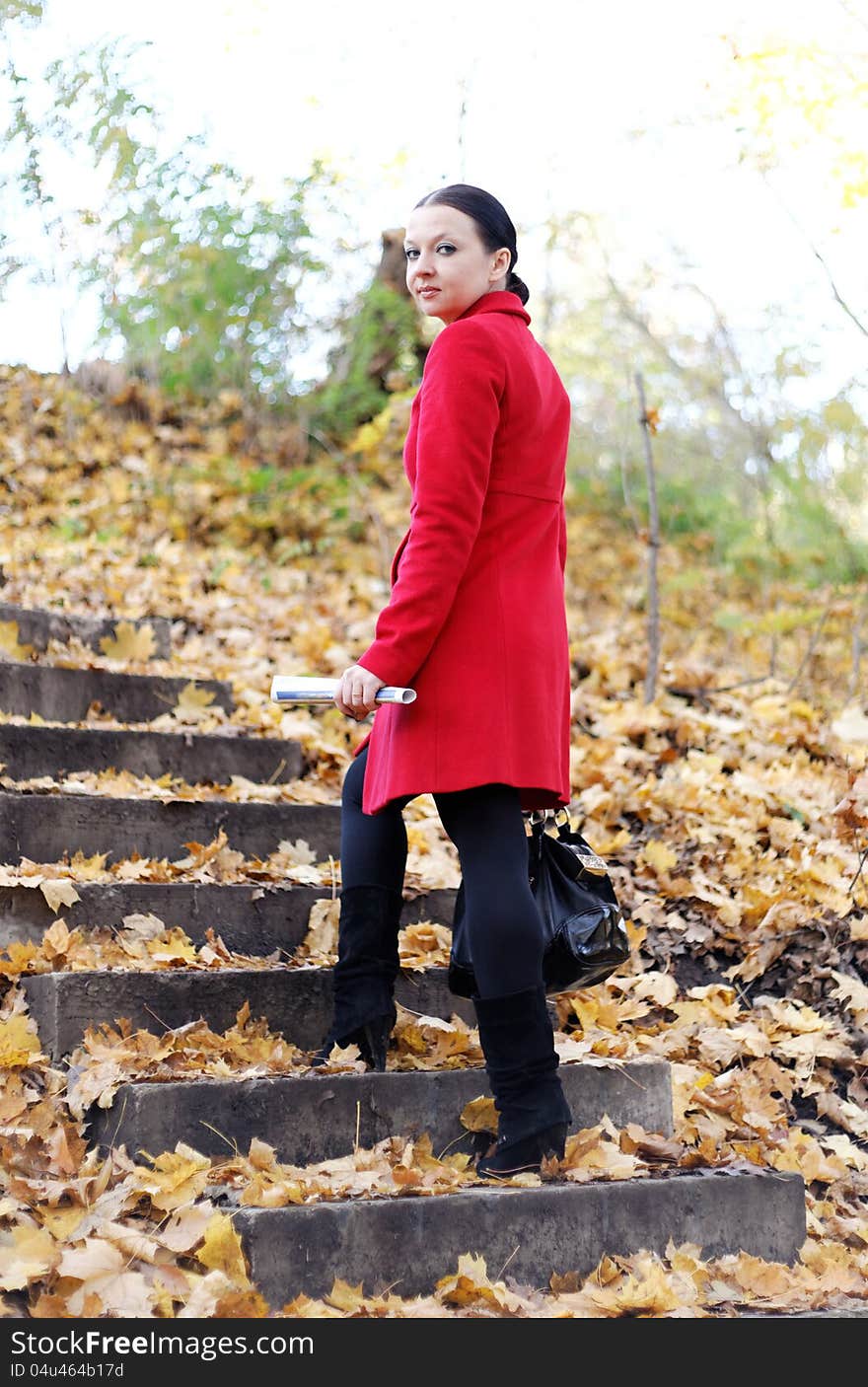 Girl in the red coat is the ladder fall day