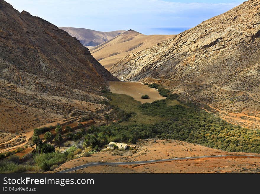 A valley on the way from Betancuria to El Cofete beach. A valley on the way from Betancuria to El Cofete beach.