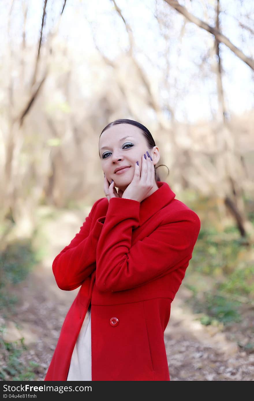 Happy Brunette Girl Portrait In Autumn