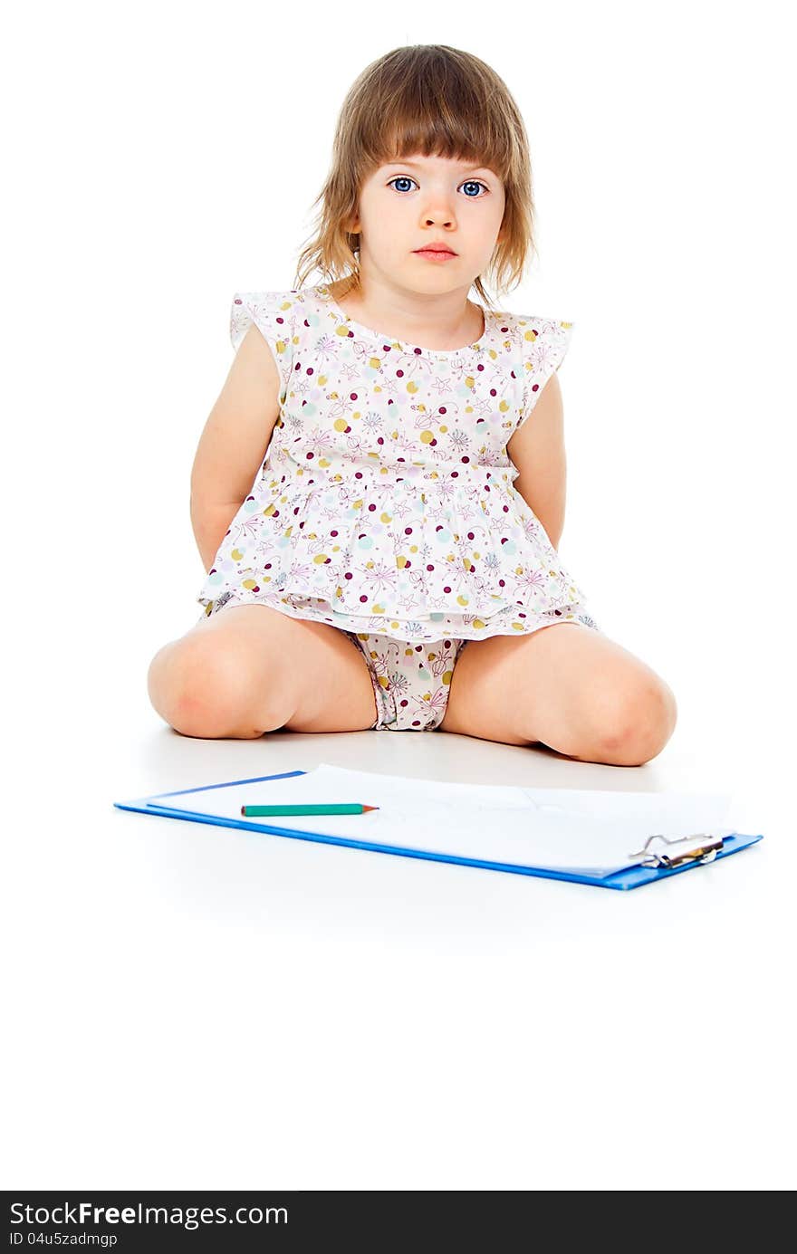 Child draws on paper on white background