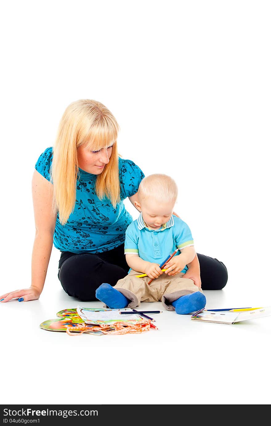 Mother and child draw with pencils