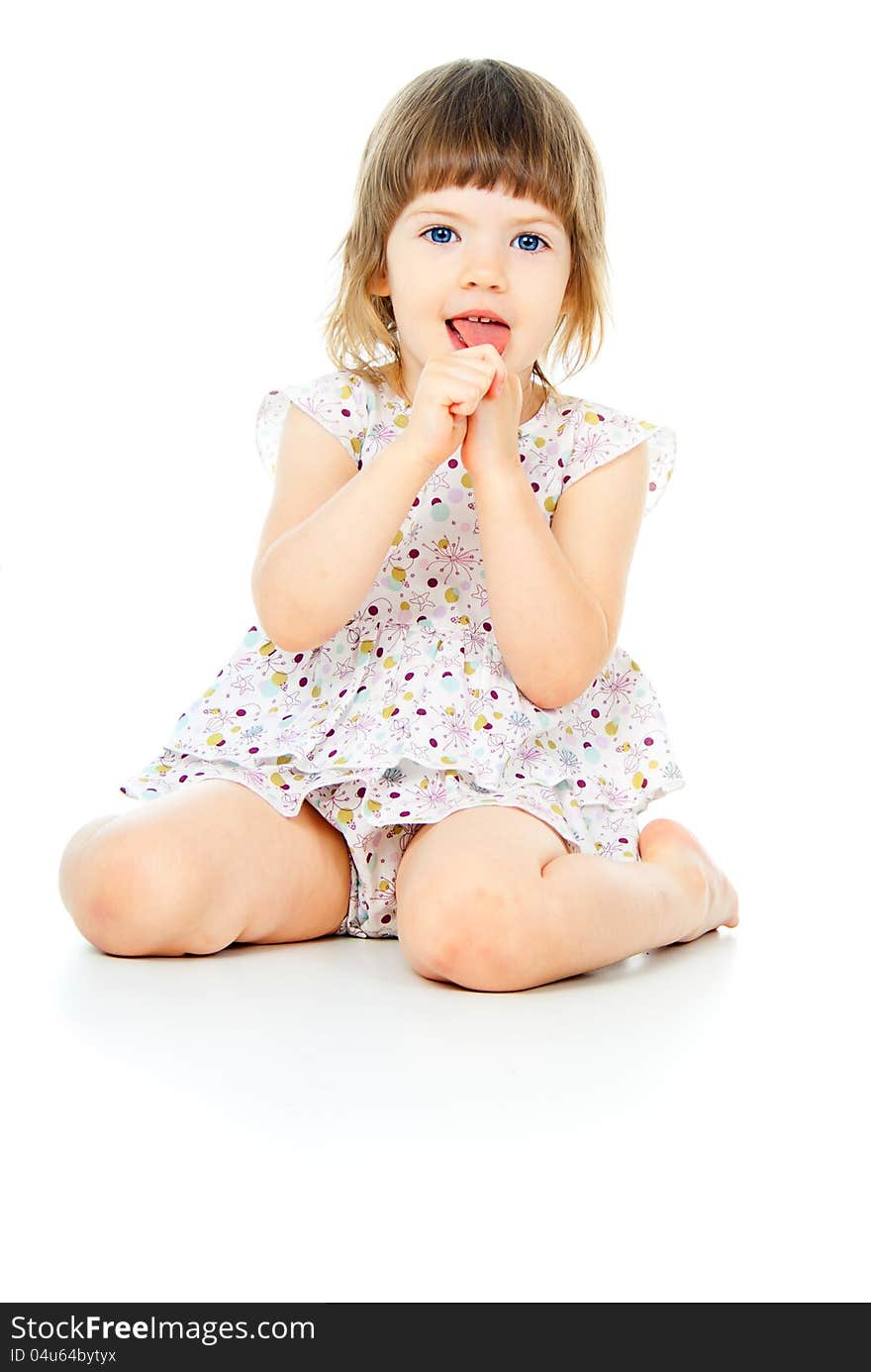 Happy little girl sitting isolated. Happy little girl sitting isolated