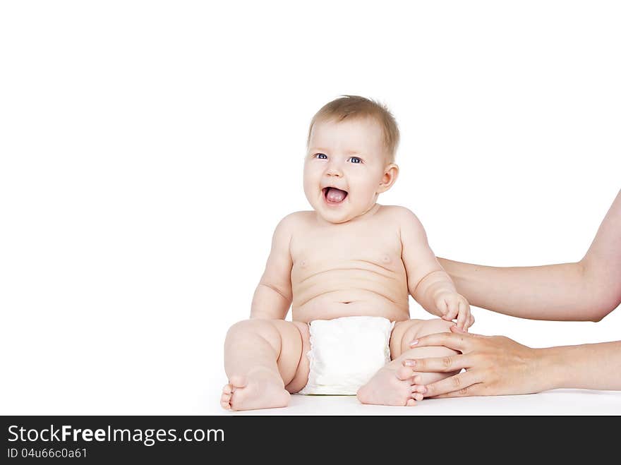 Baby laughing in diapers on white background