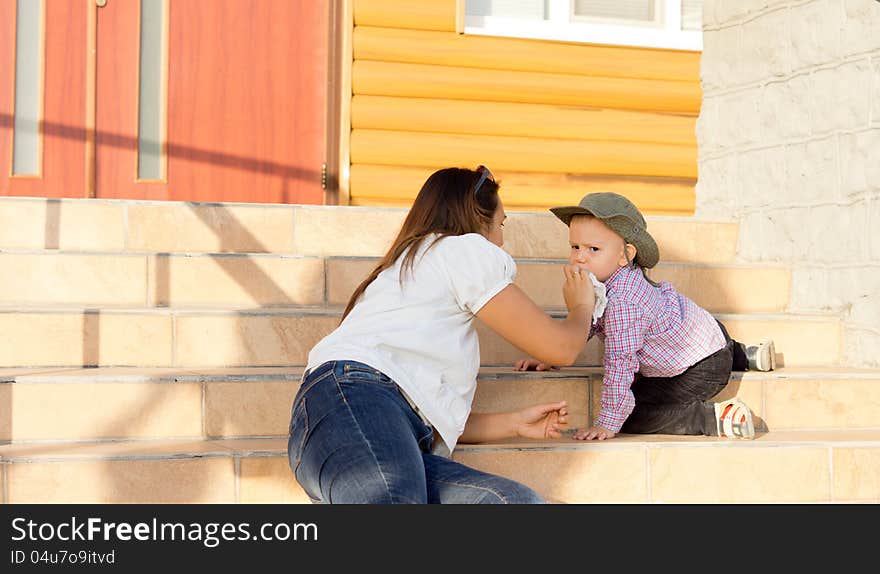 Mother Wiping Her Sons Face