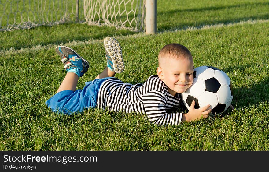 Young Boy With A Soccer Ball