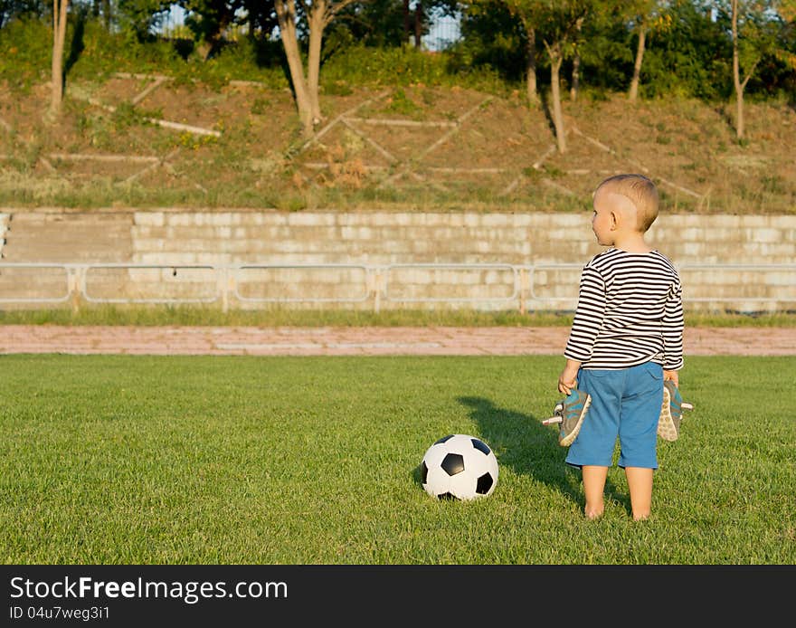 Barefoot Boy With Soccer Ball