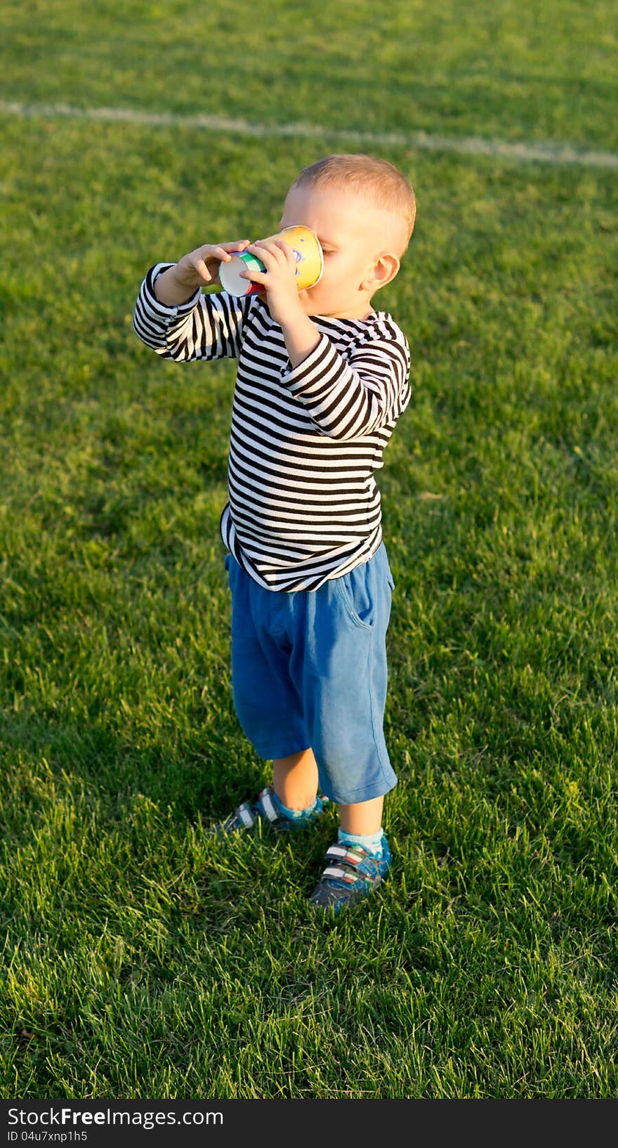 Little boy enjoying a drink