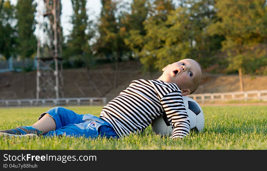 Small boy playing with a soccer ball