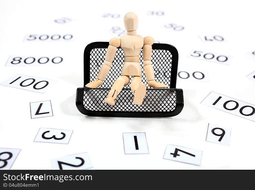 Manikin man sitting on a bench in a sea of numbers. Manikin man sitting on a bench in a sea of numbers.