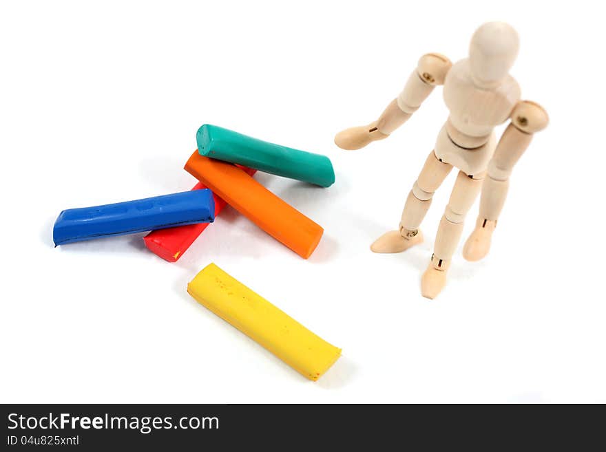 Manikin man standing next to colourfull bars. Manikin man standing next to colourfull bars.