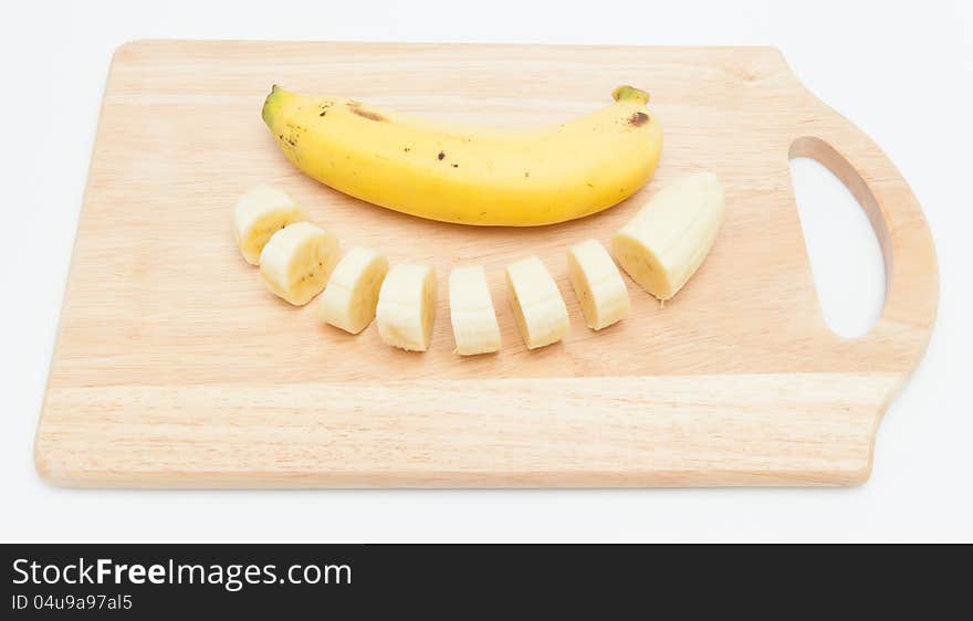 Bananas  on Wooden Chopping Board.