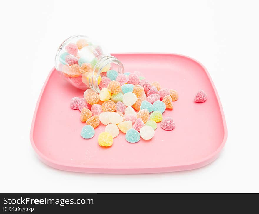 Colorful of jelly and sugar on pink plate.