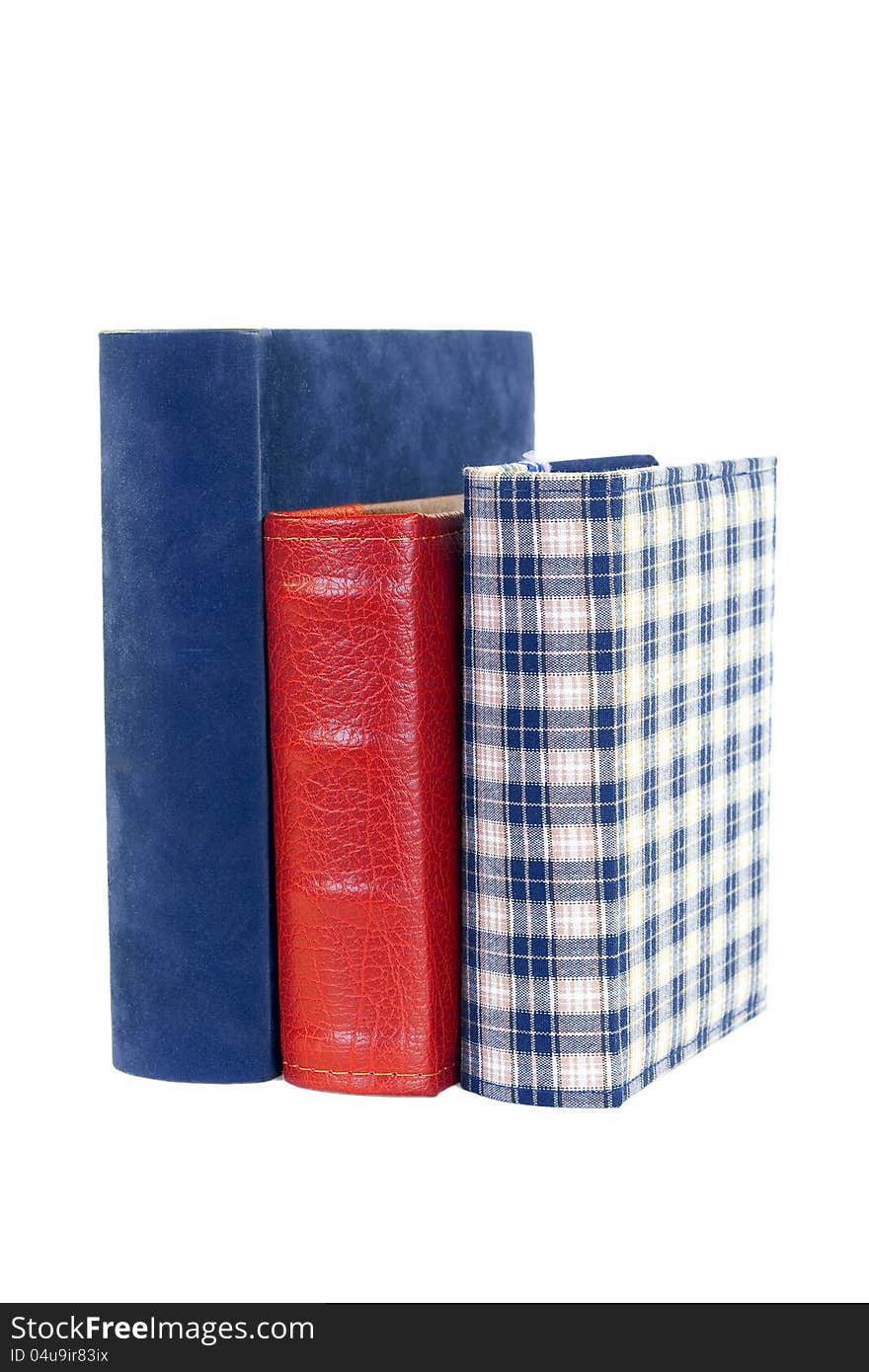 Three bound books on a white background. Three bound books on a white background