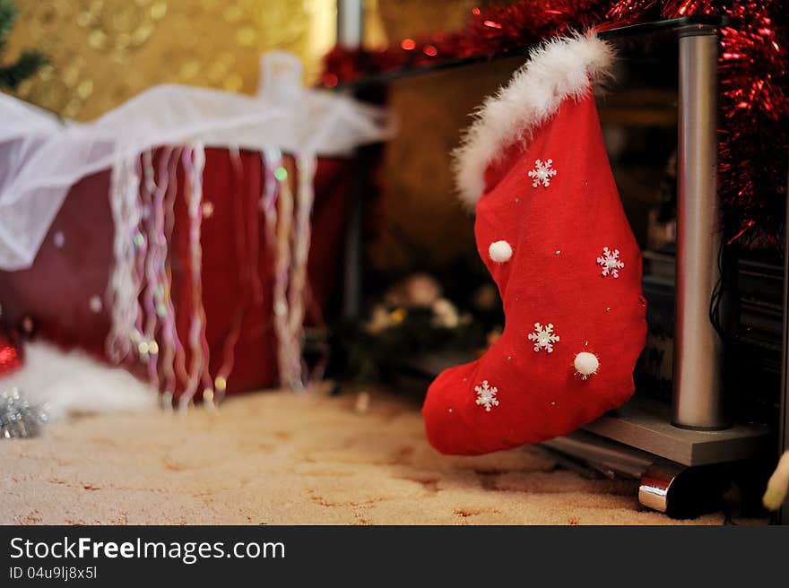 Hanging red Christmas boots with white snowflakes. Hanging red Christmas boots with white snowflakes