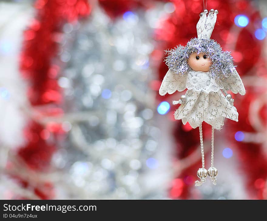 On the shiny, new year background toy handmade white angel