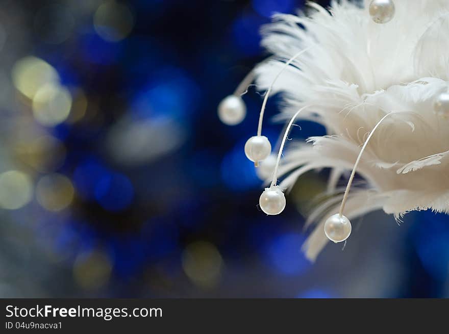 On a blue background with a large white lights Christmas Toy. On a blue background with a large white lights Christmas Toy