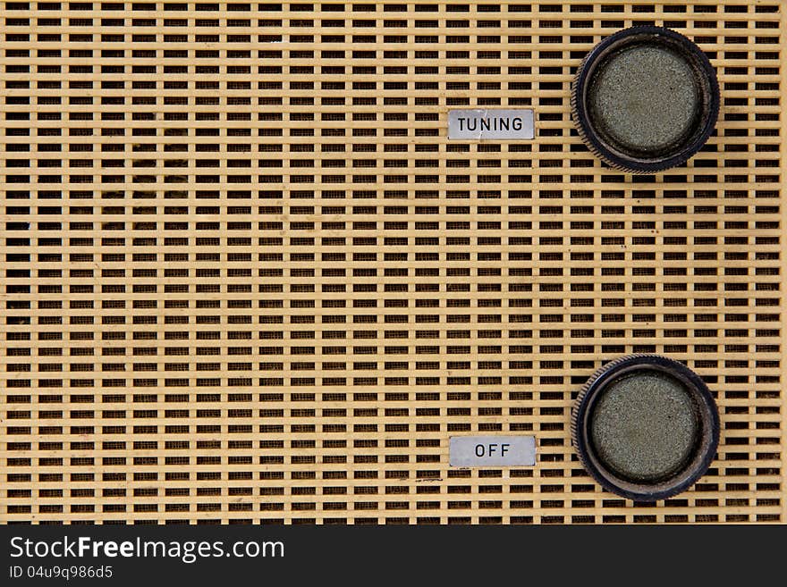 Close up image of vintage radio knob