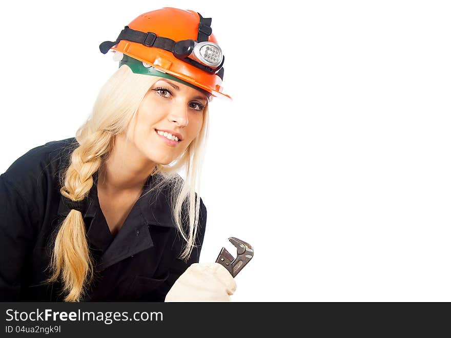 Builder of girl in a helmet looks. Builder of girl in a helmet looks