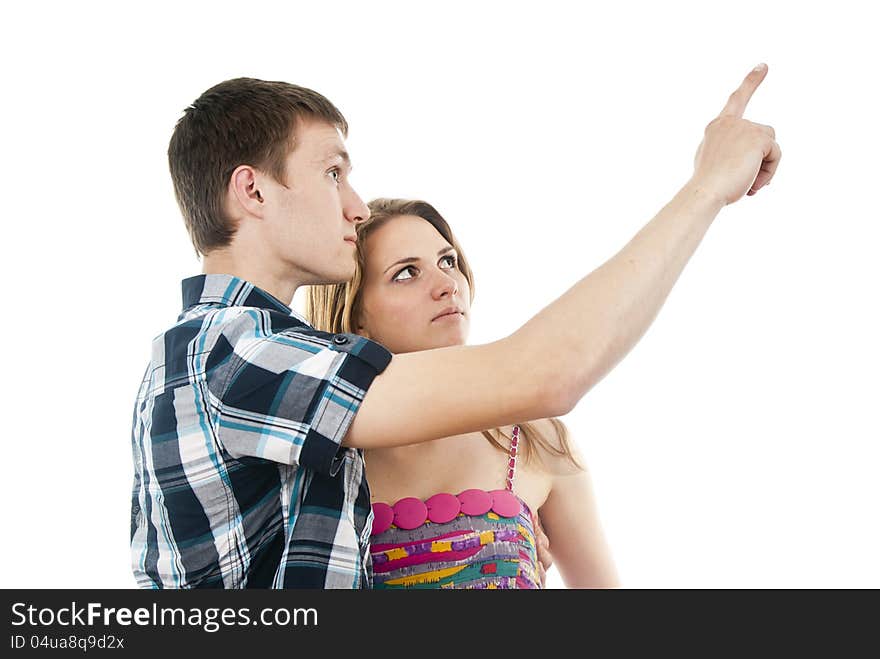 Happy guy with a girl indicates upwards