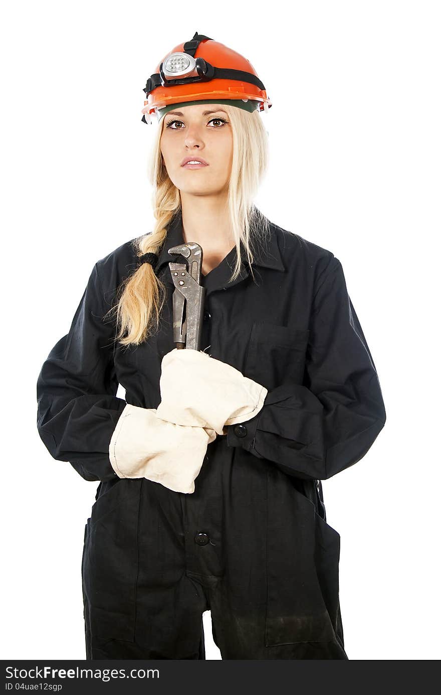 Builder girl in a helmet with a key isolated on white background