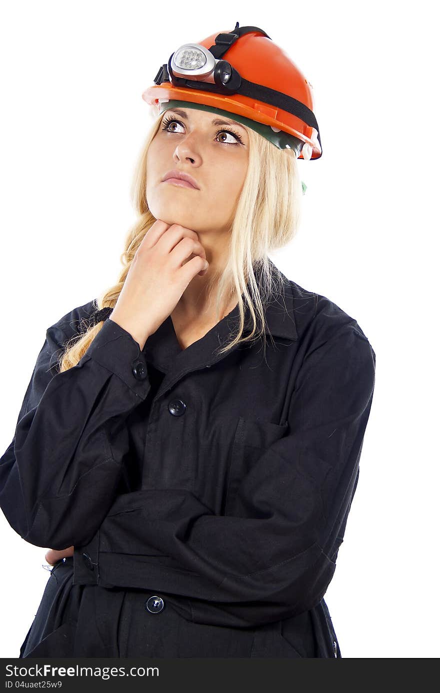 Builder girl in a helmet thinking isolated on white background. Builder girl in a helmet thinking isolated on white background