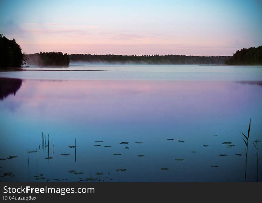 Sunrise by the lake called Barken, in Sweden, Söderbärke