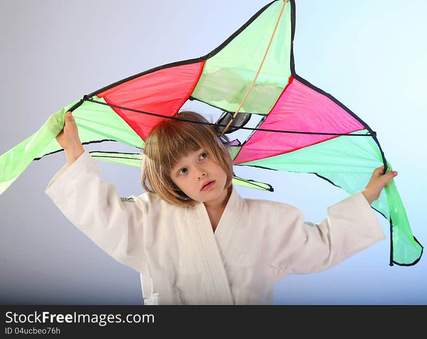 Girl with kite in studio