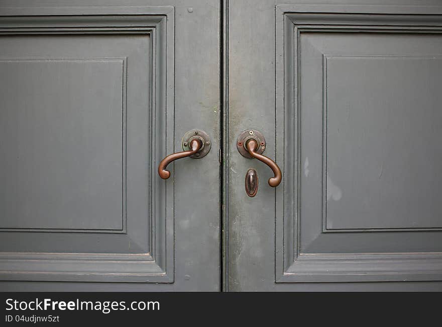 Door handles with an old double wood door