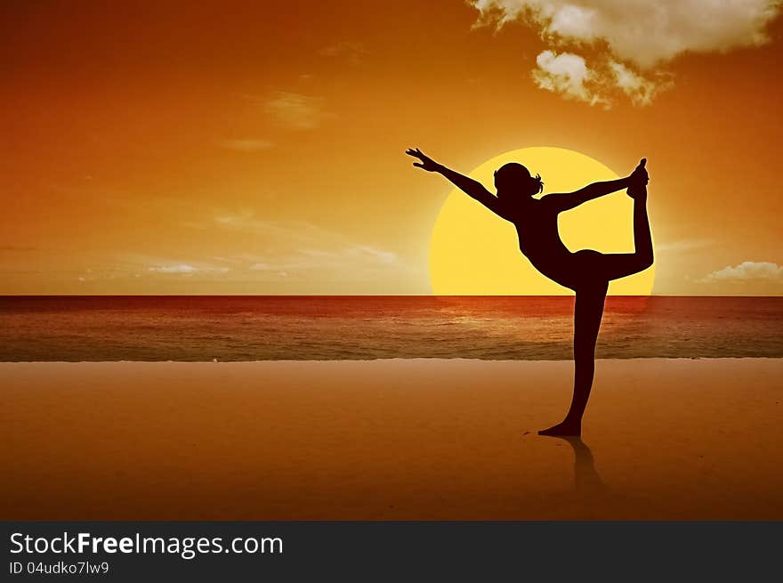 A girl is doing yoga on the beach.