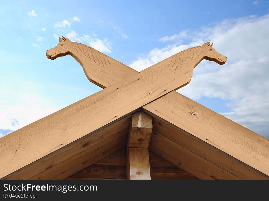 Carved wooden details on a roof ridge