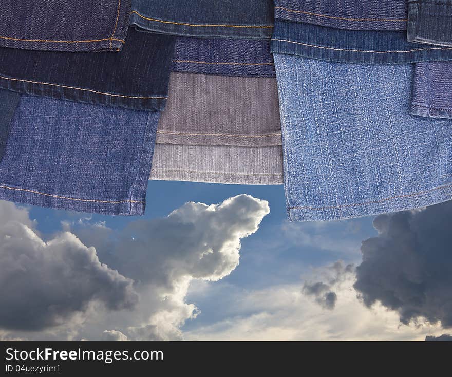 Jeans Legs On The Cloudy Sky.