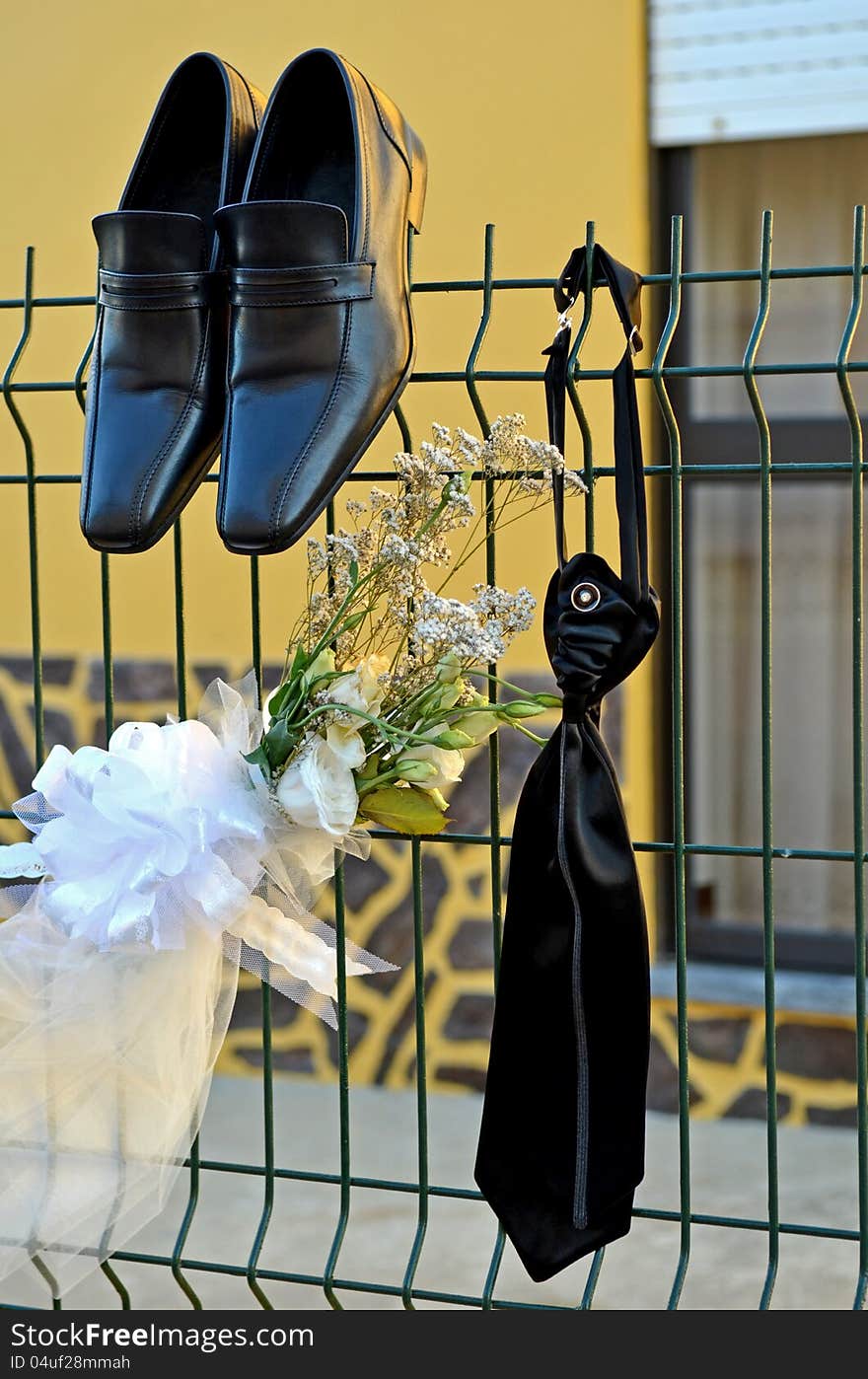 Shoes and tie of a groom wedding suit in outdoor . Shoes and tie of a groom wedding suit in outdoor .