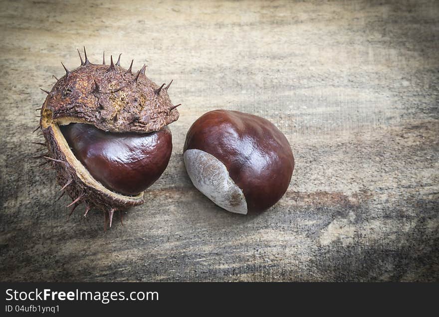 Nice shot of chestnuts on wood texture