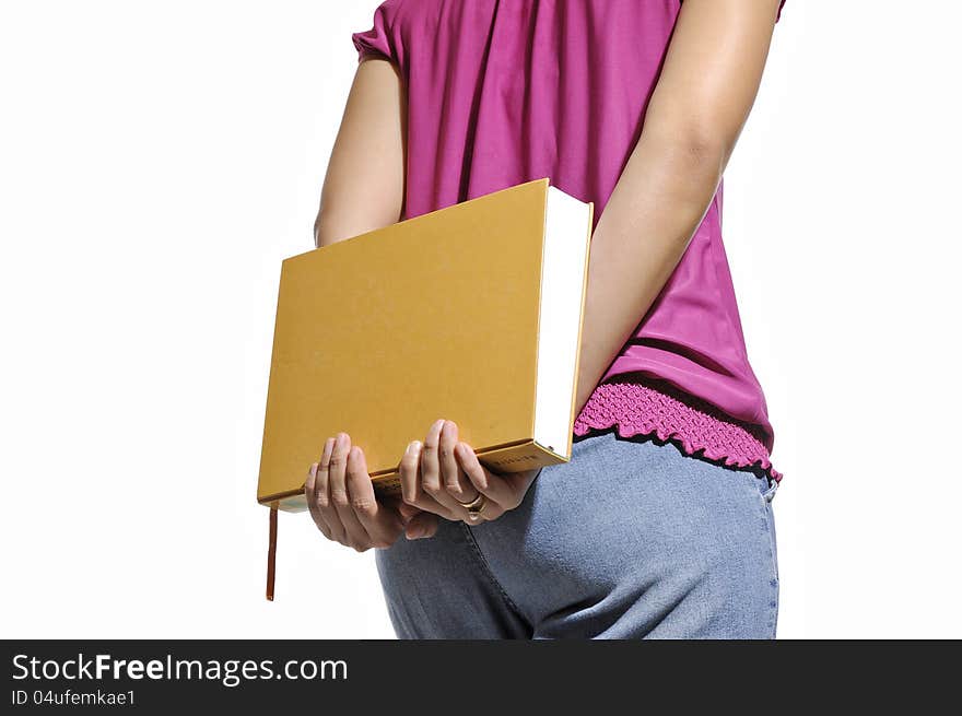 Woman bring book with her hand isolated over white background. Woman bring book with her hand isolated over white background