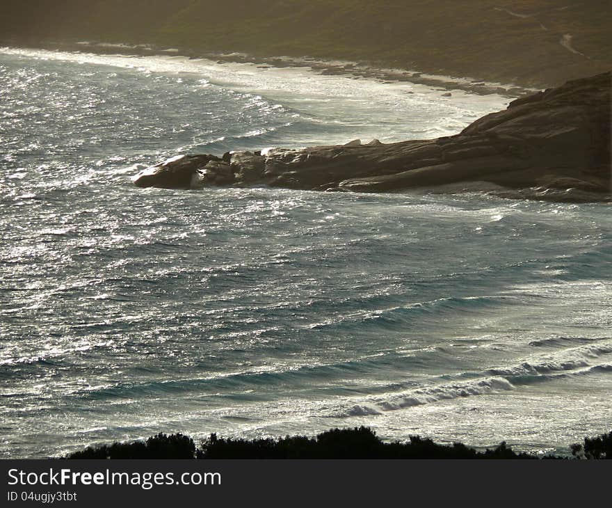 Icy waves and rocky seaside.