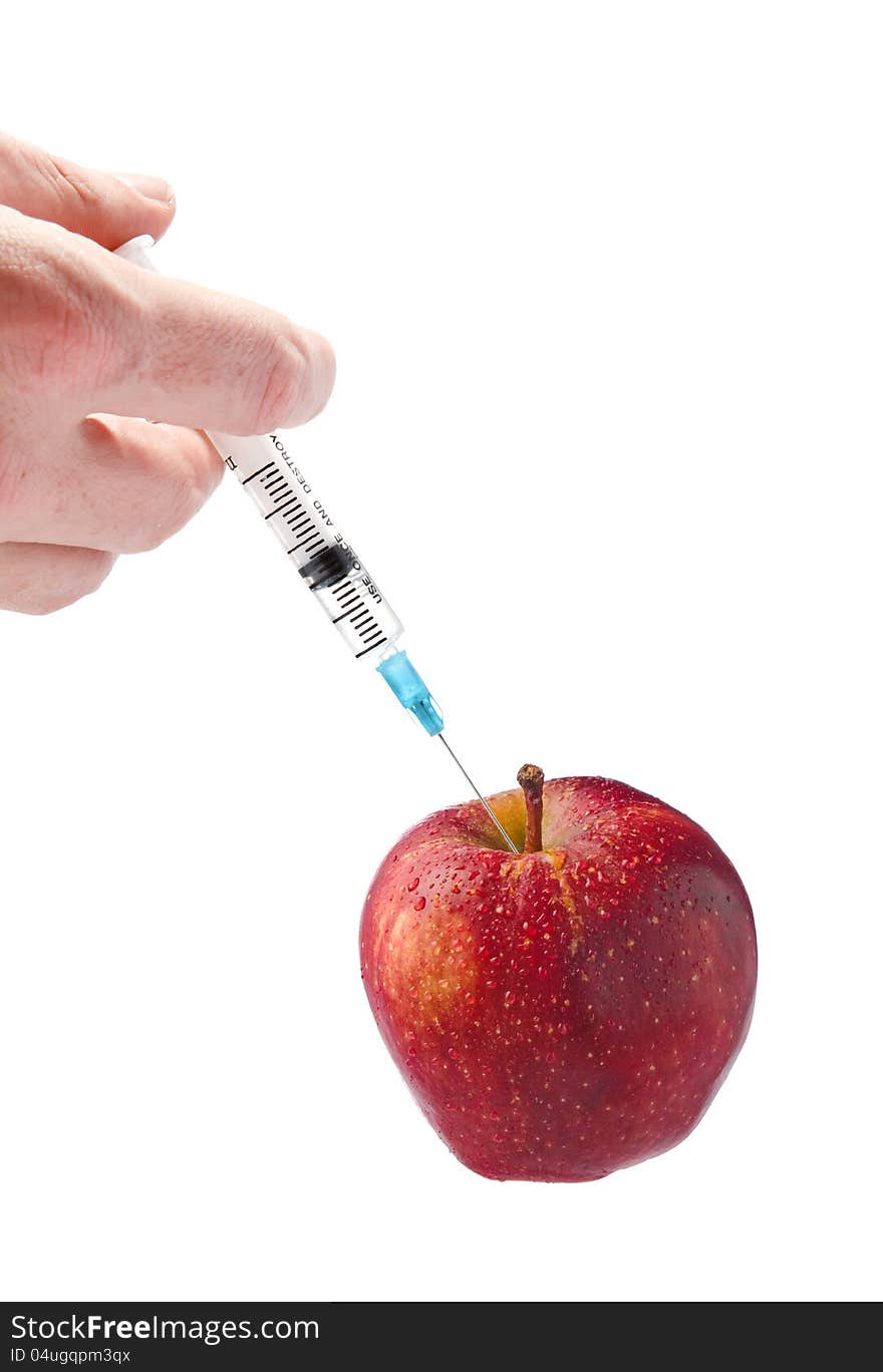 Red apple with a syringe on a white background