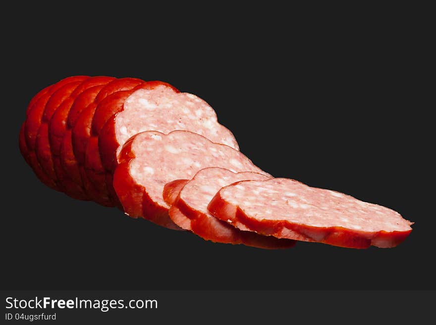 Fresh salami isolated on grey