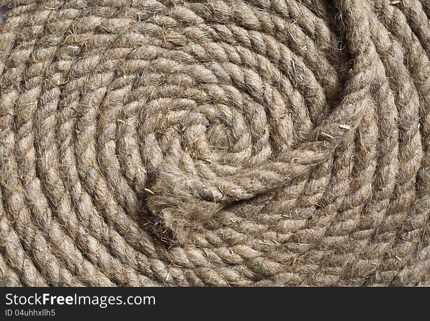 Old hemp rope coils closeup. Good background. Old hemp rope coils closeup. Good background