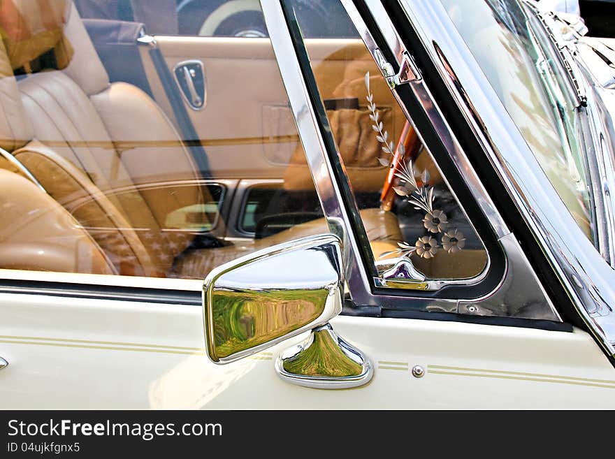 Rear view mirror of a classic car. Rear view mirror of a classic car