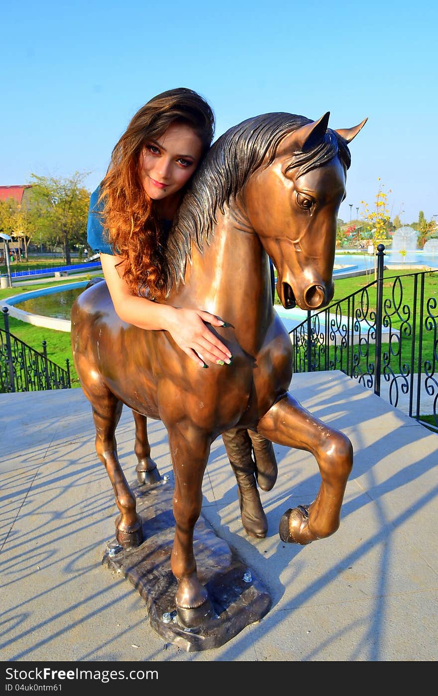 Image of a girl ridding a horse