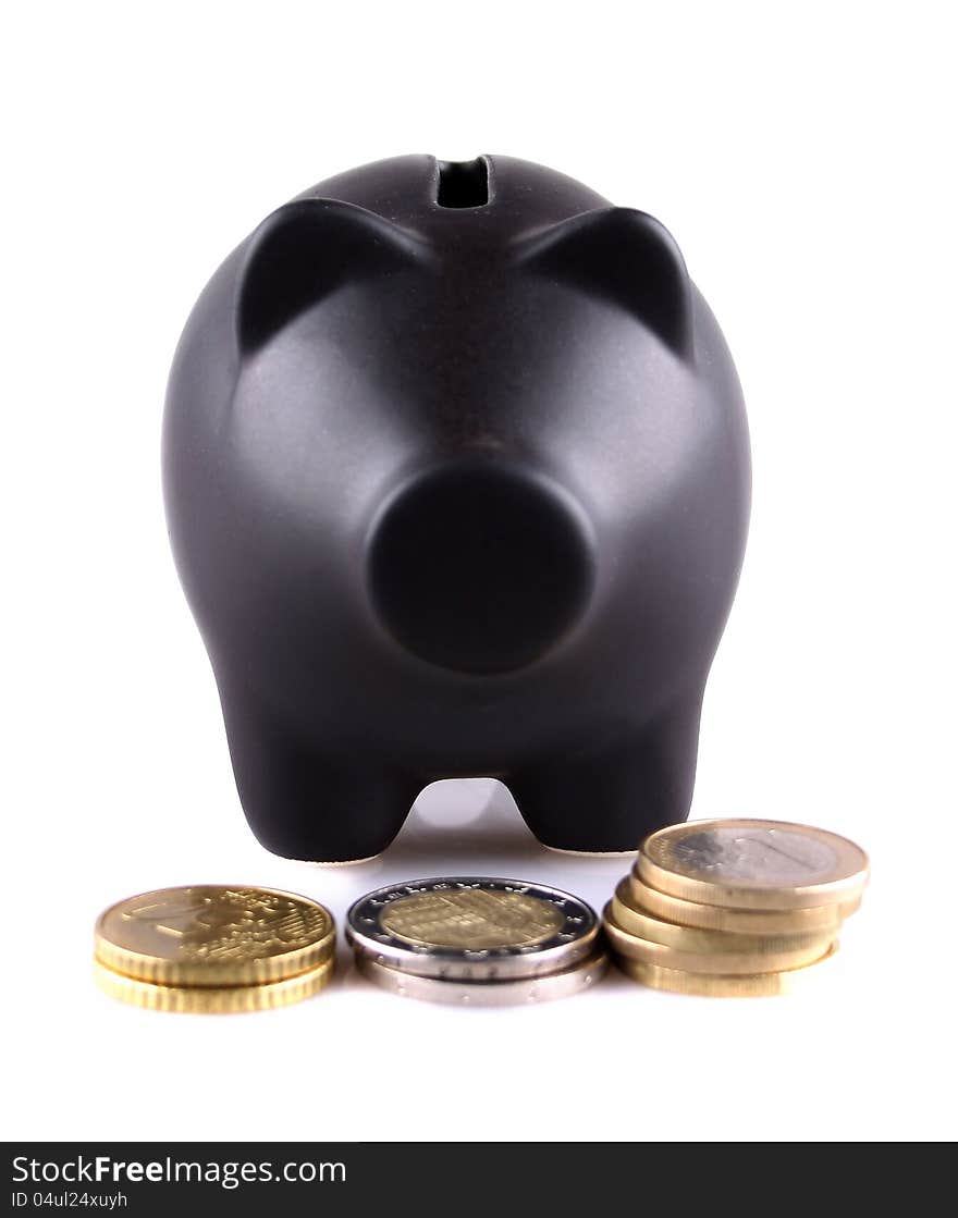 Black piggy bank with euro coins on white background