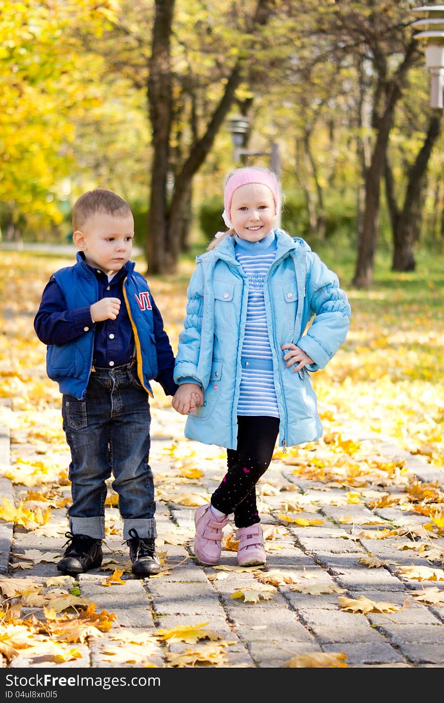 Children posing in an autumn park