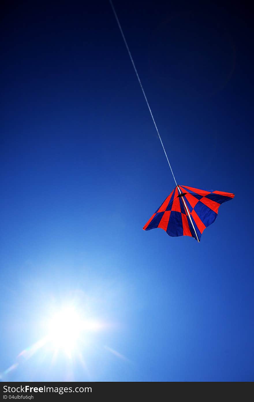 Kite on blue sky