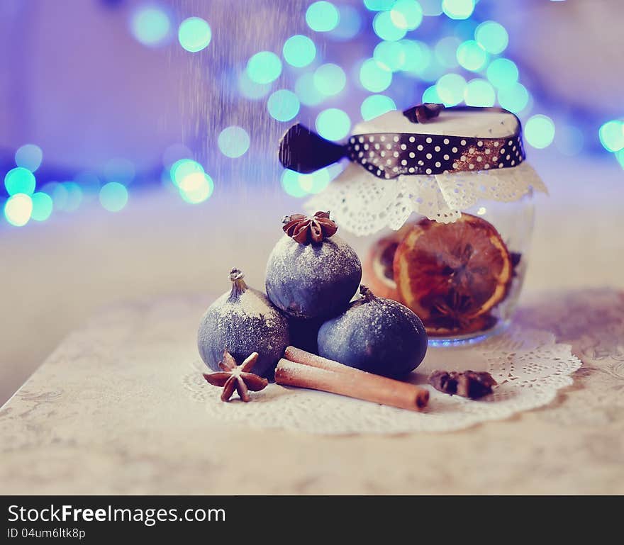 Christmas still life fragrant, beautiful spices on a background of lights. Christmas still life fragrant, beautiful spices on a background of lights