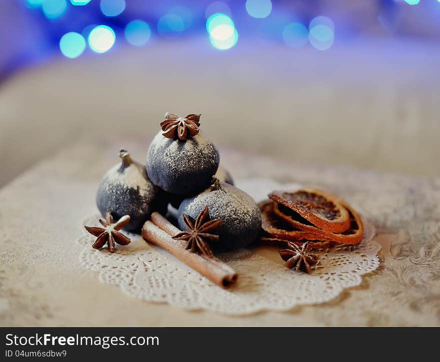 Christmas still life fragrant, beautiful spices on a background of lights. Christmas still life fragrant, beautiful spices on a background of lights